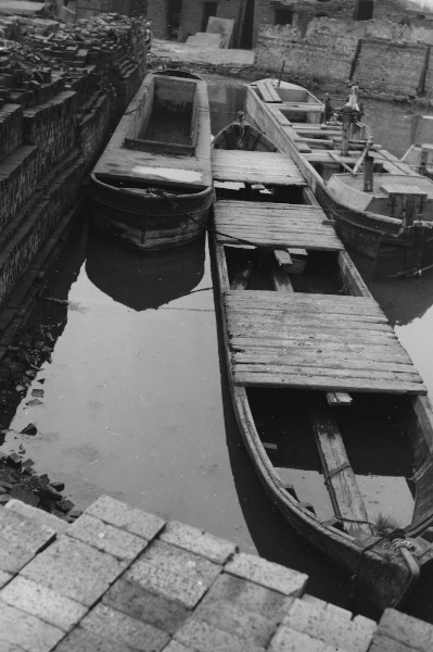 image B.C.N. Derelict hand dredger & mud hoppers lying in the old Rattle Chain Brickworks Basin (also derelict) on the Island Line (453ft level) near Albion Gas Works, 1955.