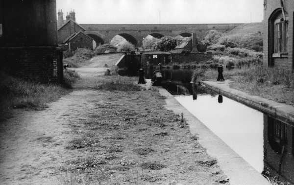 image Dudley No 2 Line (Blowers Green Jn) B.C.N. Parkhead Junction at top of Blowers Green Bottom Lock. O.W.W. Rly Viaduct in middle distance above Lock No 2. B.C.N. Parkhead Engine & wharf on R.H. side. Photo 1955