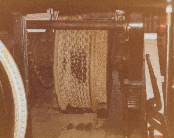 image Silt Dredger Bertha: Engine shaft at top & chain drums. L/H side: Slack chain on drum goes to stern to raise & lower scraper