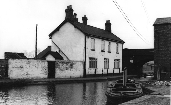 image Cannock Extension Canal, B.C.N. Pelsall Old Stop & Toll Office, Friar Bridge in background, 1960